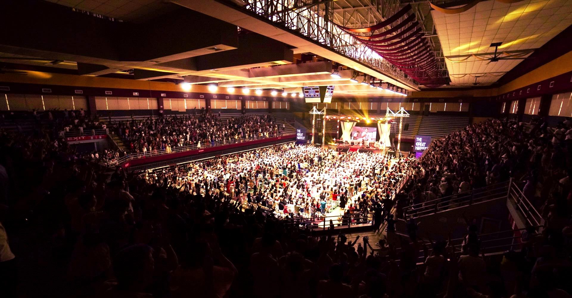 Thousands of people filling the arena for a Christ the Healer worship celebration in Davao City