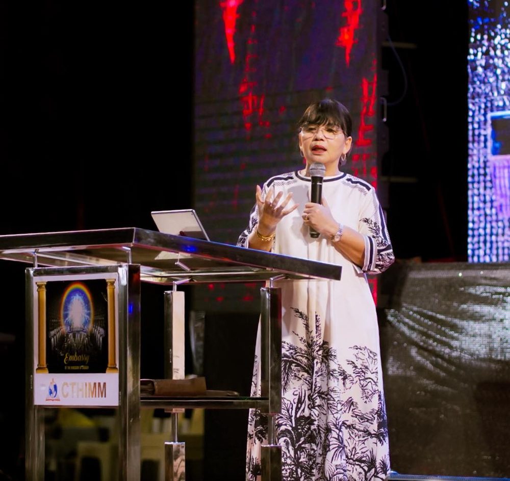 Mrs. Bishop Ruth Cubos preaching from the pulpit